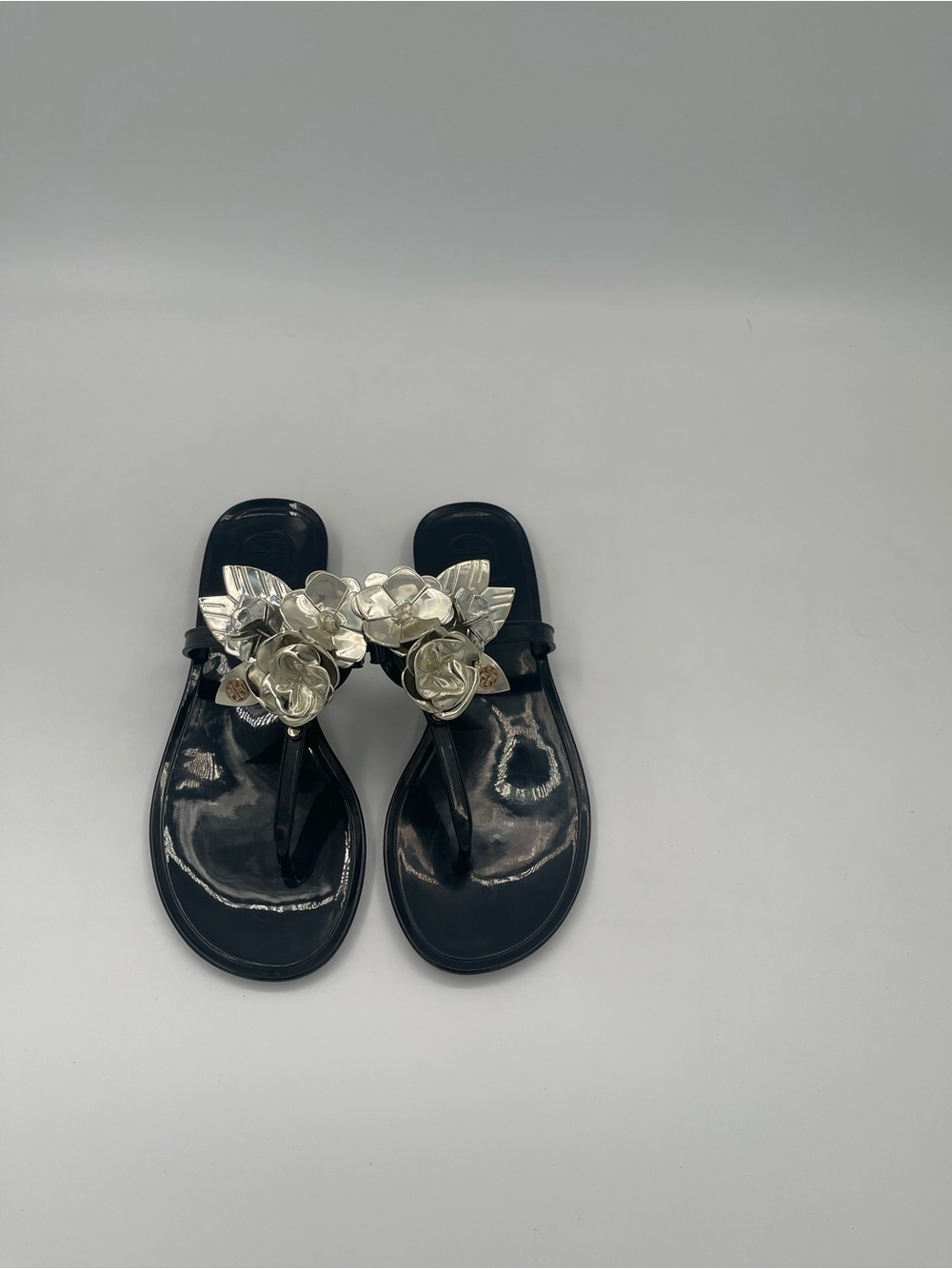 Tory Burch Black Jelly Thong Sandals with Silver Floral Embellishment